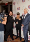 Andy Langer (L) interviews Billy Gibbons and Turk Pipkin during the 10th Annual Nobelity Project Feed The Peace Awards at the Four Seasons Hotel on February 15, 2015 in Austin, Texas.